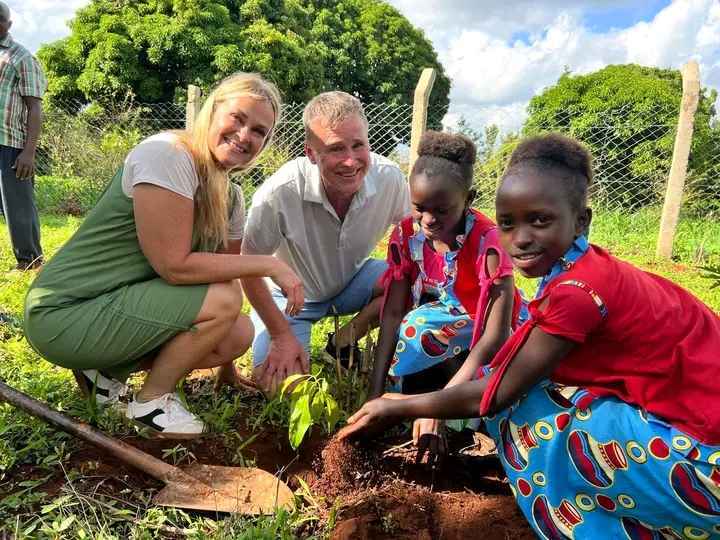 Jackline and Olive Planting a Tree